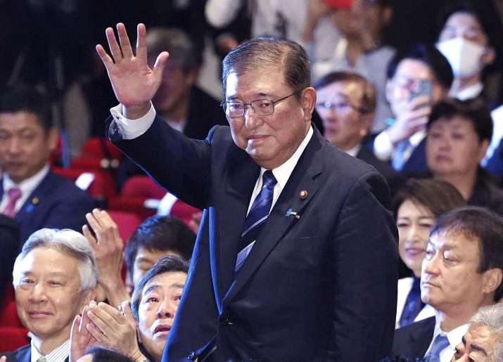 India Tv - Former Japanese defence minister Shigeru Ishiba waves after winning the LDP leadership vote on Friday.