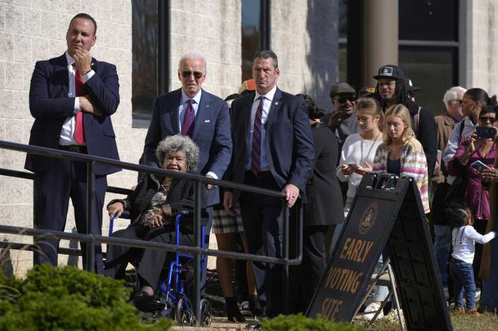 India Tv - US President Joe Biden, standing in a queue at a polling station alongside first-time voters after c