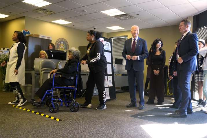 India Tv - US President Joe Biden, standing in a queue at a polling station alongside first-time voters after casting his early-voting ballot for the 2024 general elections