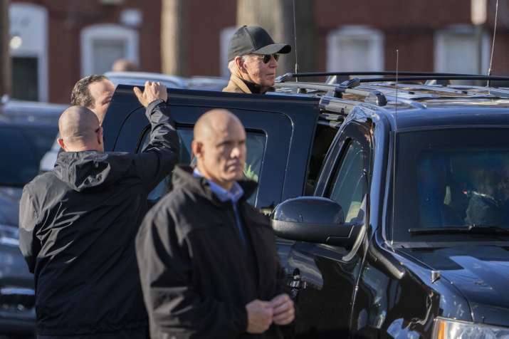 India Tv - Surrounded by Secret Service agents, President Joe Biden steps into a vehicle in Wilmington