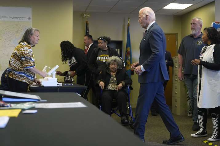 India Tv -  Joe Biden at a polling station alongside first-time voters after casting his early-voting ballot fo