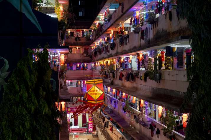 India Tv - A residential building illuminates with lights on the occasion of Diwali