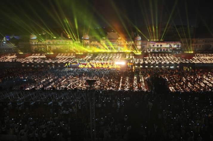 India Tv - : ‘Ram ki Paidi’ is illuminated during a laser show near the Saryu river as part of ‘Deepotsav 2024’