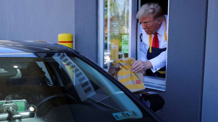 India Tv -  Donald Trump serves food at a McDonalds restaurant 