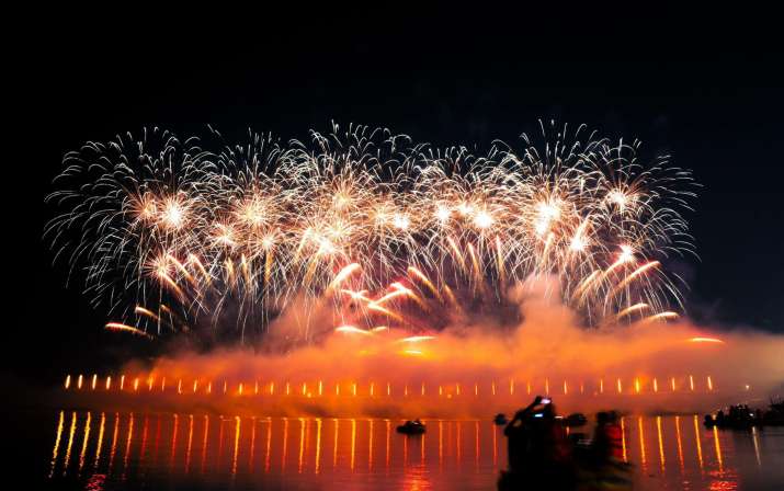 India Tv - Fireworks illuminate the sky above the banks of the Saryu river during ‘Deepotsav 2024’ celebration 