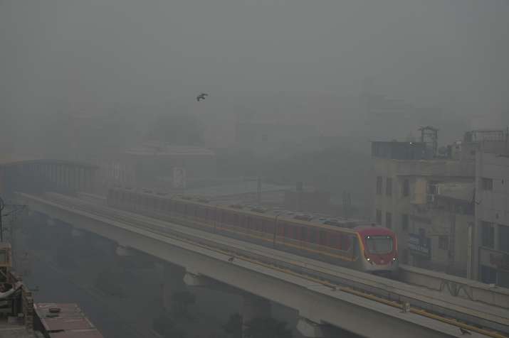 India Tv - Orange Line Metro Train runs as heavy fog reduces visibility, in Lahore, Pakistan