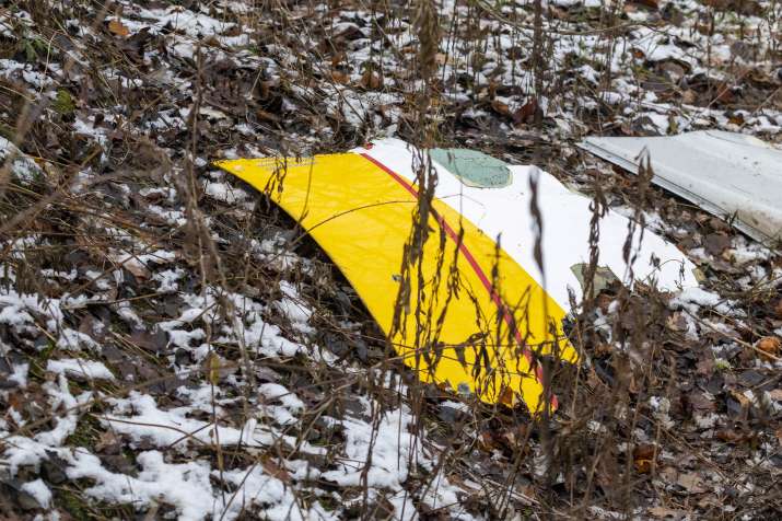 India Tv - A piece of debris from a DHL cargo plane which crashed into a house is seen near the Lithuanian capi