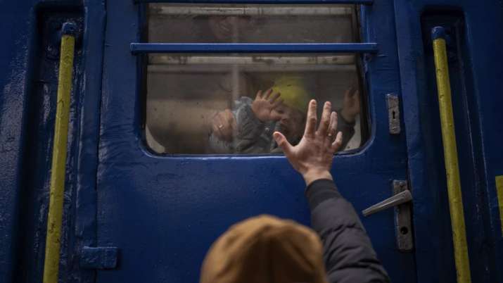 India Tv - Stanislav, 40, says goodbye to his son David, 2, and his wife Anna, 35, on a train to Lviv at the Ky