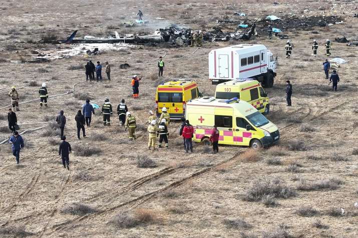 India Tv - The wreckage of Azerbaijan Airlines Embraer 190 lays on the ground near the airport of Aktau, Kazakh