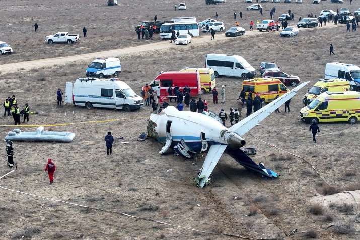 India Tv - The wreckage of Azerbaijan Airlines Embraer 190 lays on the ground near the airport of Aktau, Kazakh