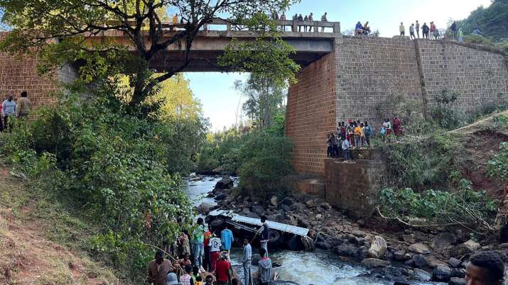 India Tv - People view a truck that fell off the Gelan Bridge as it was returning from a wedding ceremony in th