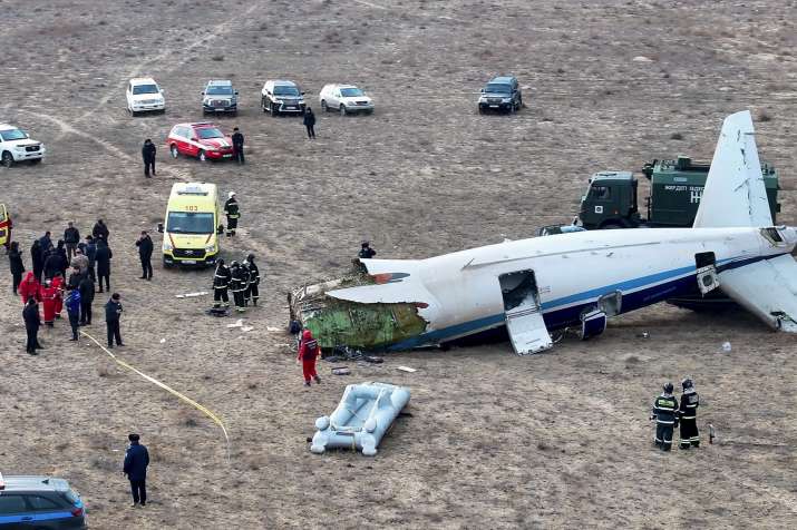 India Tv - The wreckage of Azerbaijan Airlines Embraer 190 lays on the ground near the airport of Aktau, Kazakh