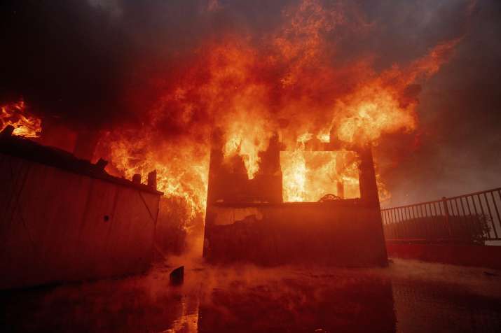 India Tv -  The Palisades Fire burns a property in the Pacific Palisades