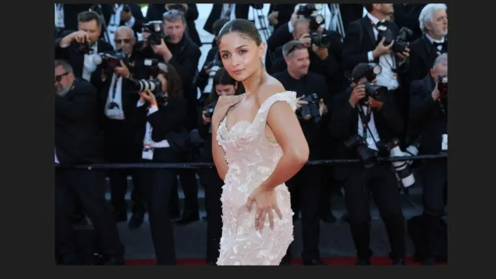 India Tv - She tied her hair in a neat bun for that snatched sleek look, and opted for minimal makeup, allowing her dewy skin to do the talking.