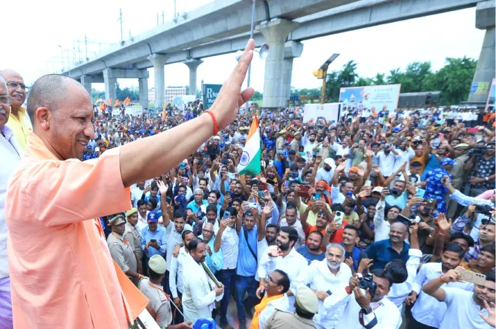 India Tv - UP CM Yogi Adityanath greets Shiva devotees