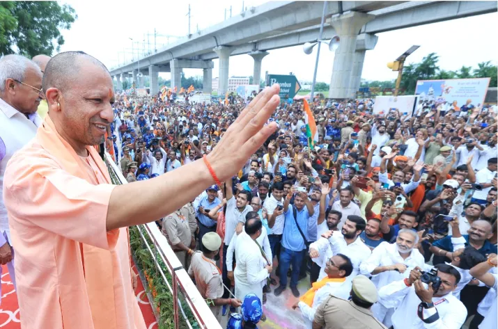 India Tv - UP CM Yogi Adityanath greets Shiva devotees