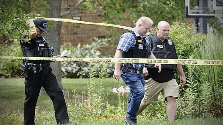 Police investigate a shooting on Friday, Aug. 5, 2022, in