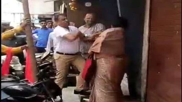 The woman was repeatedly slapped and pushed by the man.