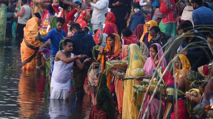 People perform the Chhath Puja. 