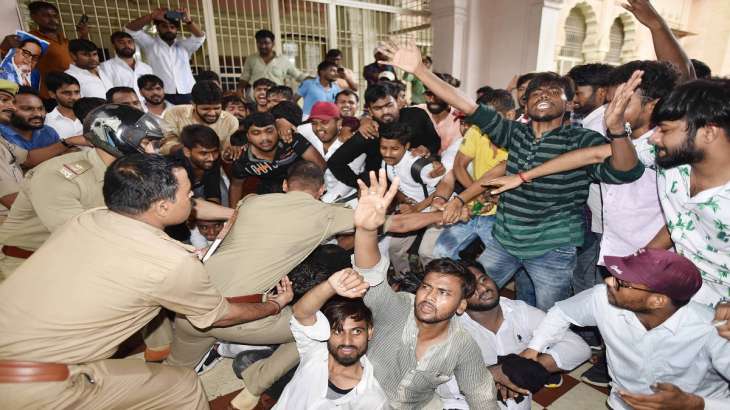 Police detain students who had gathered outside the Vice