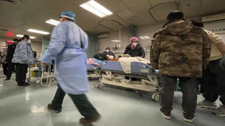 A patient rests in a bed at the emergency department of the