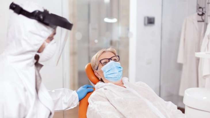 Representative image of a COVID patient being treated by the doctor