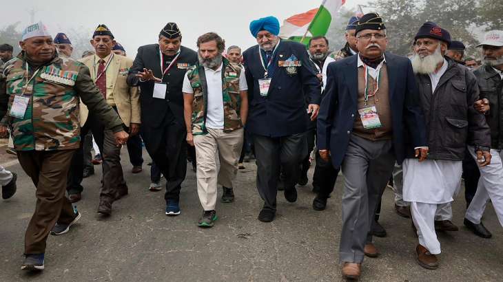 Congress leader Rahul Gandhi walks with ex-servicemen