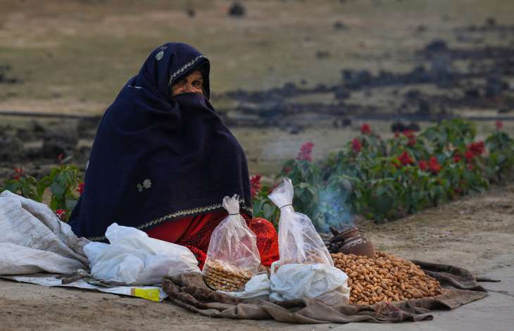 Street vendors sell peanuts on a chilly winter evening in New