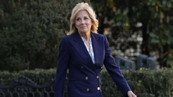 First lady Jill Biden walks out of the White House in