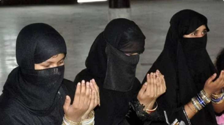 Women offering namaz.