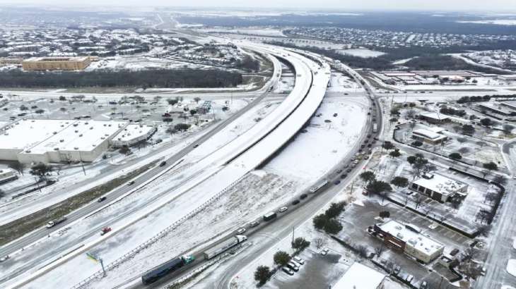 An icy mix covers Highway 114 in Roanoke, Texas. 