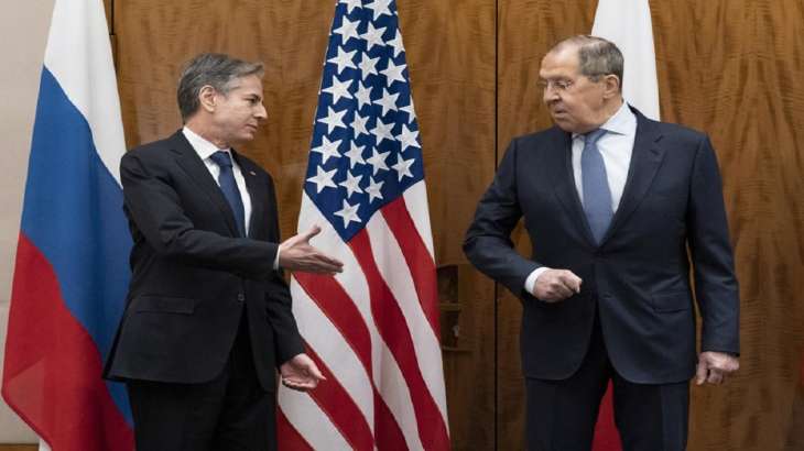 US Secretary of State Antony Blinken, left, greets Russian