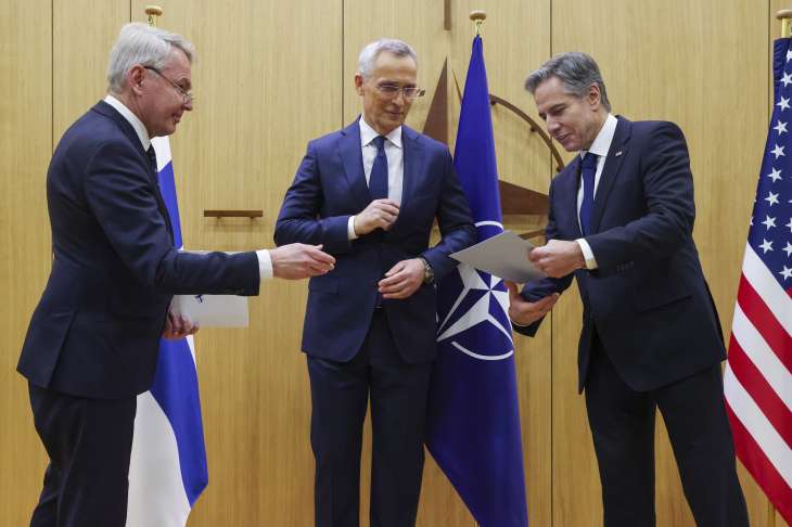 NATO Secretary-General Jens Stoltenberg, center, Finnish