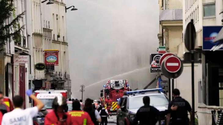 Firemen use a water canon as they fight a blaze in Paris'