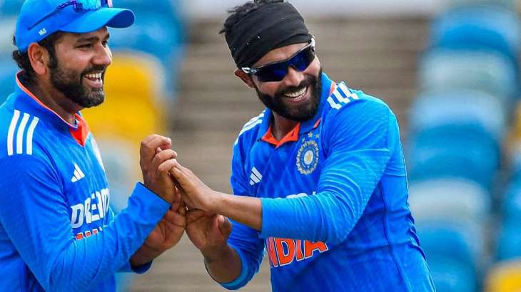 Ravindra Jadeja celebrating a wicket with Rohit Sharma in