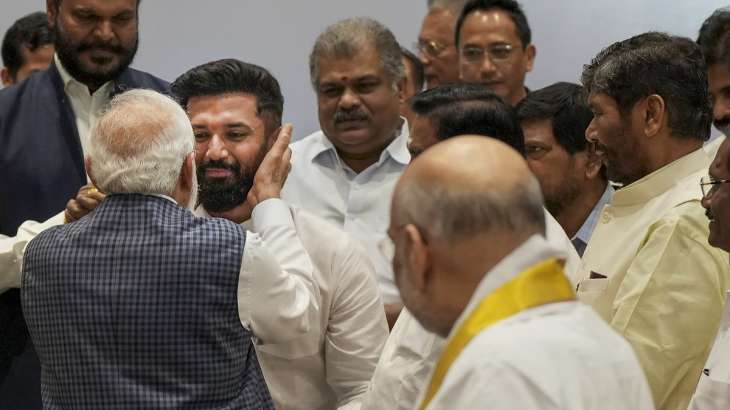 Chirag Paswan touches PM Modi's feet hugs him takes his blessings Delhi ...
