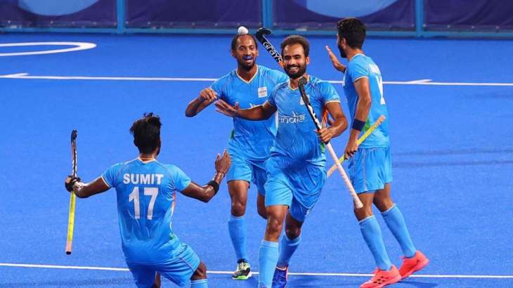 Indian hockey team celebrating win over Japan on August 11,