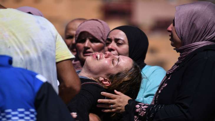 Women cry as they mourn victims of earthquake in Moulay