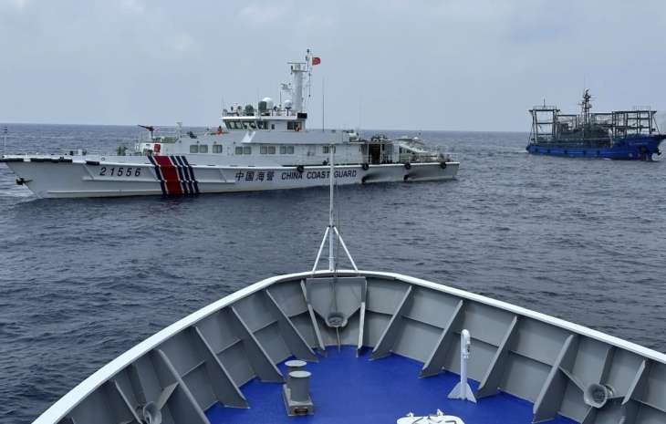 PCG vessel being blocked by a Chinese ship in the disputed