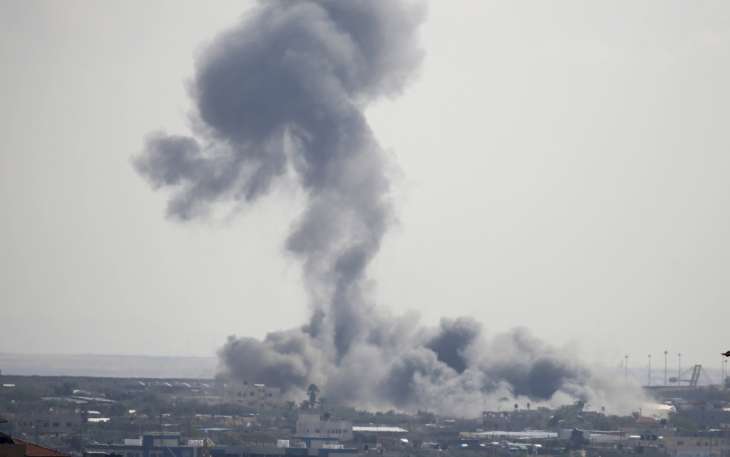Smoke rises from a building after Israeli airstrike on