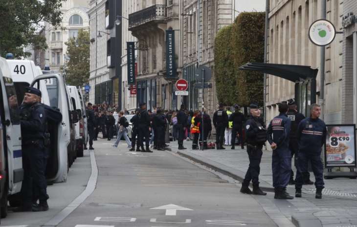 Police block the area where a teacher was killed by a man