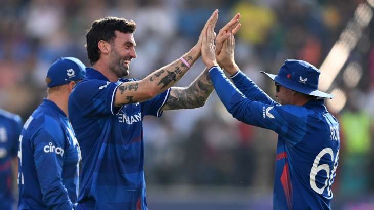 England Cricket team celebrating during their World Cup game against Bangladesh in Dharamsala.