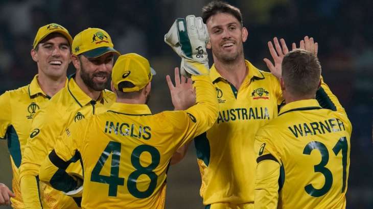 Australian cricket team celebrates a wicket at the Arun Jaitley Stadium.