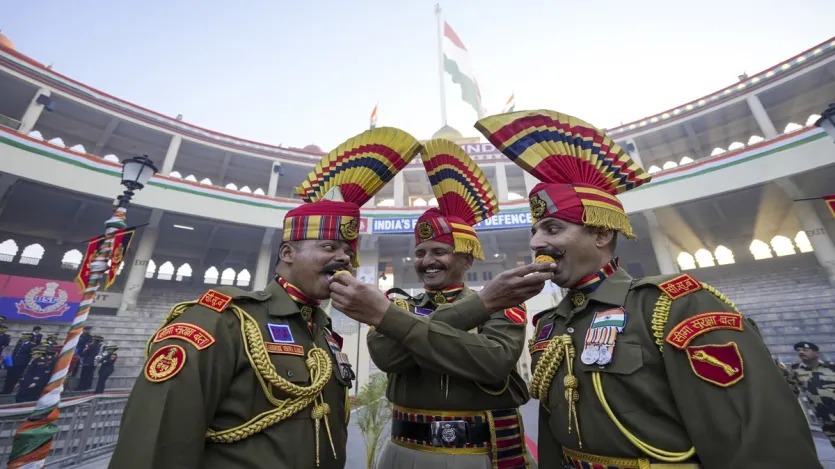 
Border Security Force (BSF) personnel celebrate the 76th Republic Day Parade at the Attari-Wagah border near Amritsar.