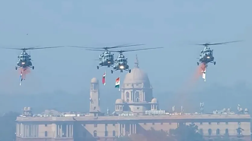 Indian Air Force helicopters fly over Kartavya Path carrying the Indian and Indonesian national flags. 