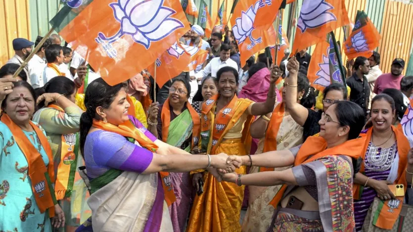 BJP workers celebrate the party's victory in the Delhi Assembly elections, in Nagpur