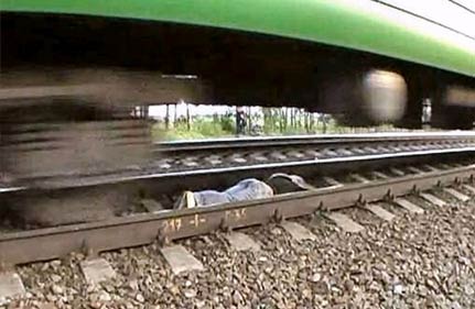 russian girl lies on tracks as train speeds over her russian girl lies on tracks as train speeds over her