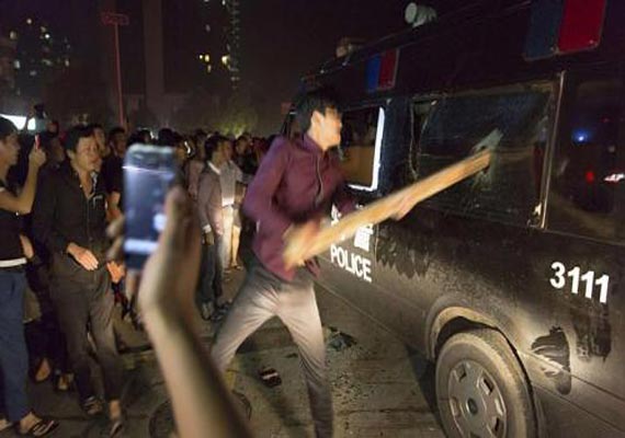 thousands stage protest in flood hit chinese city