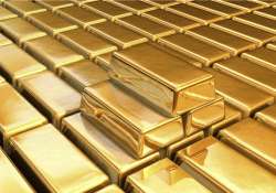 gold futures marginally lower on global cues