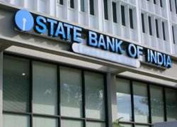 falling rupee may spook rate cut hopes says sbi